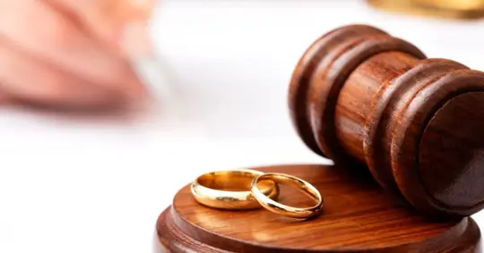 wedding rings on a gavel